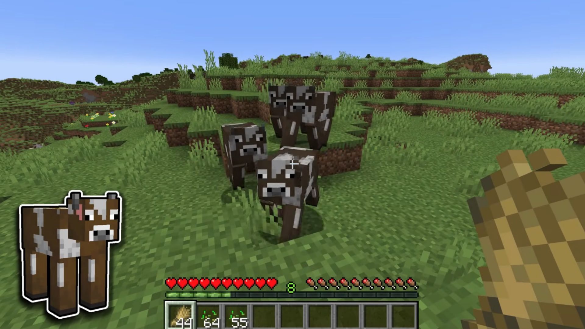 cows roaming in the overworld and following the player when he shows wheat to them.